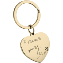 Porte clé personnalisé en forme de cœur en acier inoxydable doré avec message manuscrit gravé et anneau métallique.